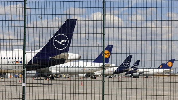 Parked aircraft, operated by Deutsche Lufthansa AG, during a strike by the airline's pilots, at the under construction Terminal 3 of Frankfurt Airport in Frankfurt, Germany, on Friday, Sept. 2, 2022. Lufthansa suspended almost its entire flight operations in Frankfurt and Munich because of a strike by pilots who are demanding higher pay, adding another day of major disruptions to what has already turned into a summer of travel chaos. Photographer: Alex Kraus/Bloomberg