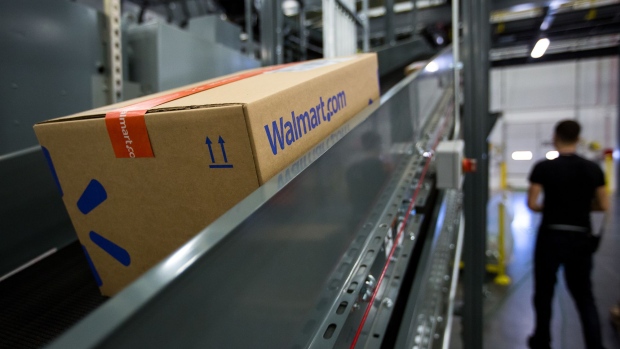 A package moves along a conveyor belt inside a Wal-Mart Stores Inc. fulfillment center in Bethlehem, Pennsylvania, U.S., on Wednesday, March 29, 2017. Wal-Mart Stores Inc. acquired e-commerce startup Jet.com for $3.3 billion in cash and stock. Jet.com Founder and his management team were put in charge of Wal-Mart's entire domestic e-commerce operation, overseeing more than 15,000 employees in Silicon Valley, Boston, Omaha, and its home office in Arkansas.