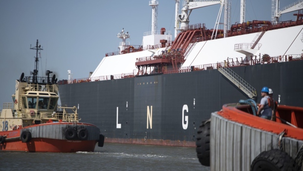 Tug boats prepare to pull out an LNG Tanker vessel at the Cheniere Sabine Pass Liquefaction facility in Cameron, Louisiana, U.S., on Thursday, April 14, 2022. Cheniere Energy, Inc. is the largest producer and exporter of liquefied natural gas (LNG) in the United States and the second-largest LNG operator in the world. Photographer: Mark Felix/Bloomberg