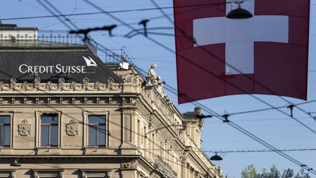 A Swiss flag hangs beyond Credit Suisse Group AG's headquarters in Zurich, Switzerland, on Friday, April 24, 2015.