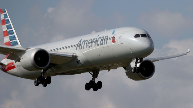 MIAMI, FLORIDA - DECEMBER 10: An American Airlines Boeing 787-9 Dreamliner approaches for a landing at the Miami International Airport on December 10, 2021 in Miami, Florida. The American Airlines company announced it will discontinue service to several international destinations in 2022 amid the ongoing shortage of Boeing 787 aircraft. (Photo by Joe Raedle/Getty Images)