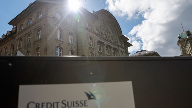 Signage for a Credit Suisse Group AG office near the headquarters of the Swiss National Bank (SNB) in Bern, Switzerland, on Monday, March 20, 2023. UBS Group AG shares slumped Monday as investors digested the news of its historic acquisition of rival Credit Suisse Group AG and began to assess the job of integrating the troubled Swiss lender. Photographer: Stefan Wermuth/Bloomberg