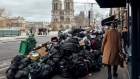 Uncollected bags of trash near Notre-Dame cathedral in central Paris in March. Photographer: Cyril Marcilhacy/Bloomberg