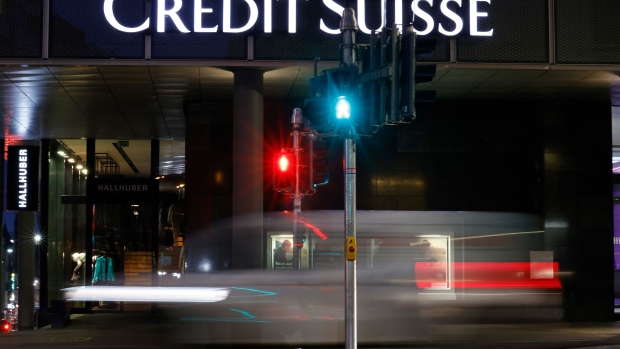 Light trails from a passing vehicle outside a Credit Suisse Group AG bank branch in Basel, Switzerland, on Tuesday, Oct. 25, 2022. Credit Suisse will present its third quarter earnings and strategy review on Oct. 27.