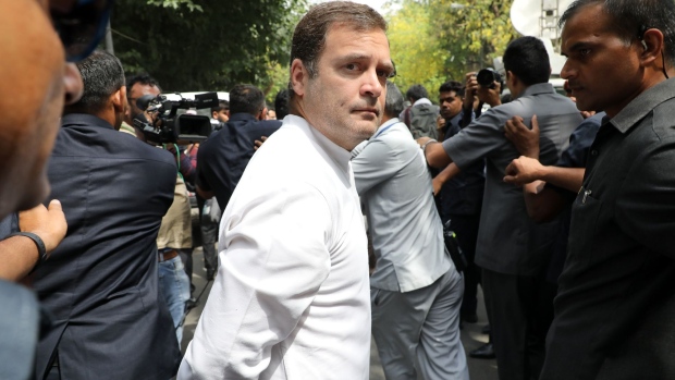 Rahul Gandhi, president of the Congress Party, center, leaves a polling station after casting his ballot during the sixth phase of voting for national elections in New Delhi, India, on Sunday, May 12, 2019. The Delhi vote is taking place along with seven states including Bihar, Haryana, Madhya Pradesh and Uttar Pradesh in this sixth of the seven rounds of polling.