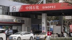 Vehicles refuel at a China Petroleum & Chemical Corp. (Sinopec) gas station in Shanghai, China, on Thursday, Jan. 7, 2021. China's energy markets are tightening as the economy rebounds and freezing weather grips much of the northern hemisphere, a dynamic that’s likely to be exacerbated by reduced Saudi oil output.