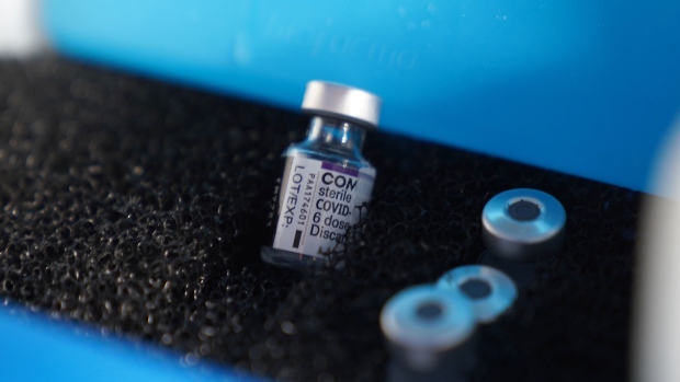Vials of the Pfizer-BioNTech Covid-19 vaccine at a health center in Jakarta, Indonesia, on Thursday, Jan. 13, 2022. Indonesia is prioritizing elderly and at-risk people to receive booster shots in a program started on Wednesday.