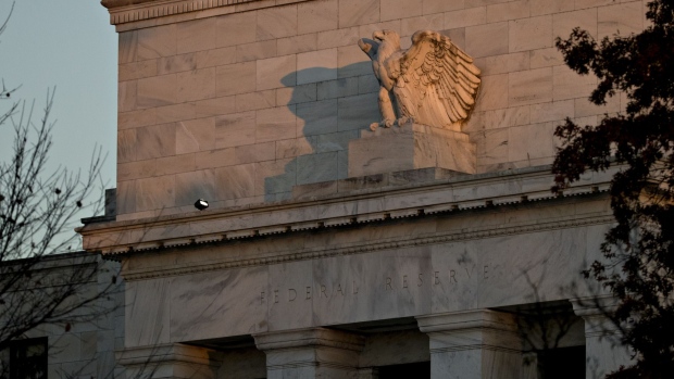 An eagle sculpture stands on the facade of the Marriner S. Eccles Federal Reserve building in Washington, D.C., U.S., on Friday, Nov. 18, 2016. Federal Reserve Chair Janet Yellen told lawmakers on Thursday that she intends to stay in the job until her term expires in January 2018 while extolling the virtues of the Fed's independence from political interference. Photographer: Andrew Harrer/Bloomberg