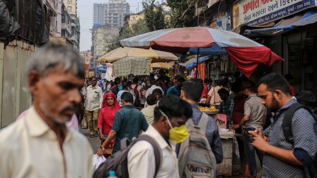 Pedestrians past stalls in Mumbai, India, on Saturday, Jan. 7, 2023. India is scheduled to release consumer price index (CPI) figures on Jan. 12. Photographer: Dhiraj Singh/Bloomberg