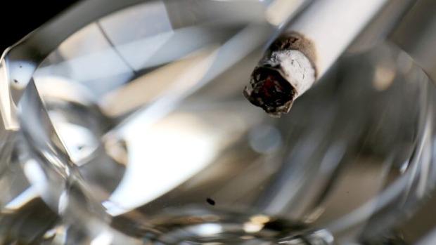 A cigarette in an ashtray. Photographer: Bloomberg Creative Photos/Bloomberg