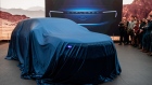 Ford’s new Explorer electric sport utility vehicle under cover during its unveiling this month in London.