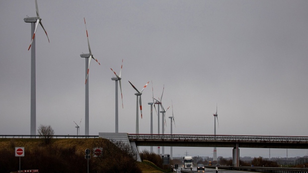 Wind turbines along a highway near Klockow in Klockow, Germany, on Tuesday, April 5, 2022. Germany's cabinet approved a package of measures on April 6 aimed to make the country independent of fossil fuels by 2035. Photographer: Krisztian Bocsi/Bloomberg