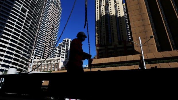 A worker at a construction site in the central business district (CBD) of Sydney, Australia, on Tuesday, Sept. 28, 2021. Australian household spending declined for a third consecutive month as the delta variant of coronavirus swept the east coast and nation’s largest cities. Photographer: Lisa Maree Williams/Bloomberg 
