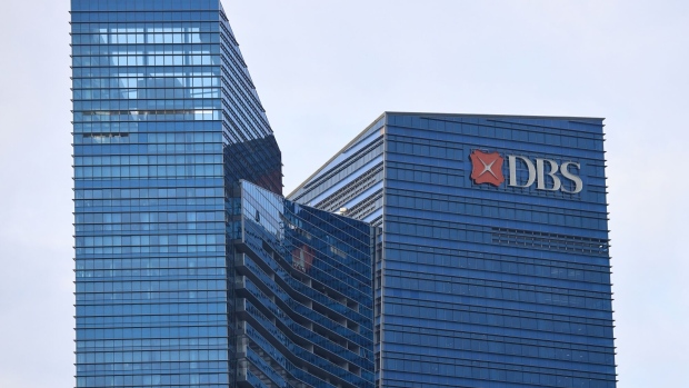 Signage for DBS Group Holdings Ltd. atop the company's head office in Singapore, on Monday, Feb. 13, 2023. DBS’s fourth-quarter profit topped estimates, helped by lending gains as a strong capital base allowed the bank to deliver a special dividend.