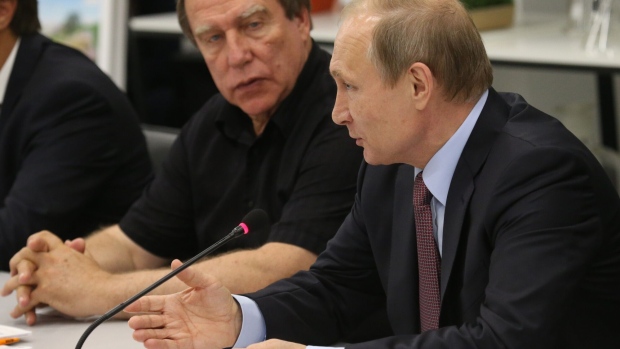 Sergei Roldugin, left, and Vladimir Putin. Photographer: Mikhail Svetlov/Getty Images