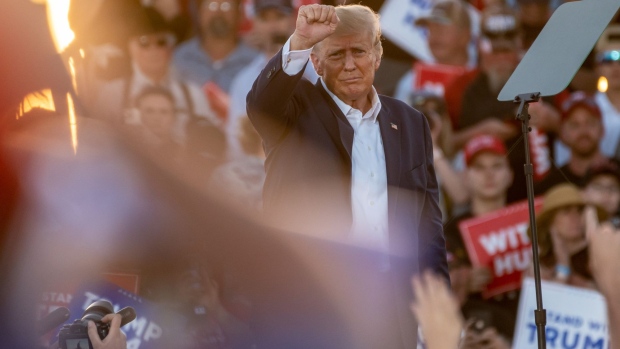 Former US President Donald Trump exits the stage after speaking at a campaign event in Waco, Texas, US, on Saturday, March 25, 2023. A defiant Trump railed against the investigations he faces and predicted he’d prevail during a rally in Waco that may be the former president’s last public appearance before he faces potential criminal charges.