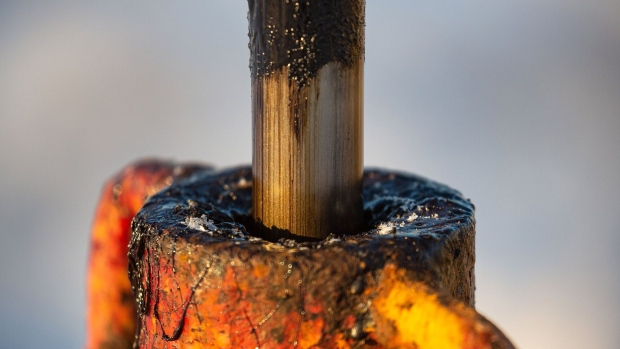 Thick black oil on the shaft of a pumping jack, also known as a "nodding donkey" in an oilfield near Dyurtyuli, in the Republic of Bashkortostan, Russia, on Thursday, Nov. 19, 2020. The flaring coronavirus outbreak will be a key issue for OPEC+ when it meets at the end of the month to decide on whether to delay a planned easing of cuts early next year. Photographer: Andrey Rudakov/Bloomberg