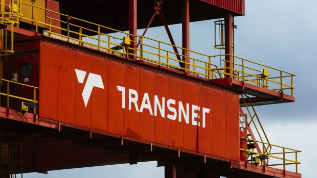 A Transnet logo stands on a rail mounted gantry crane, manufactured by Terex Corp., at the Port of Durban, operated by Transnet SOC Holdings Ltd.'s Ports Authority, in Durban, South Africa, on Friday, May 25, 2018. Transnet last year reduced its seven-year capital-investment plan by 17 percent to 229.2 billion rand in response to lower-than-anticipated freight demand. Photographer: Waldo Swiegers/Bloomberg