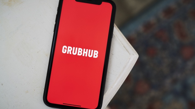 The logo for the Grubhub Inc. application is displayed on an Apple Inc. iPhone in an arranged photograph taken in the Brooklyn borough of New York, U.S., on Friday, April 10, 2020. Grubhub, the parent of food delivery app Seamless, said last month it was deferring fees for independent restaurants using the service in response to the coronavirus pandemic. Photographer: Gabby Jones/Bloomberg
