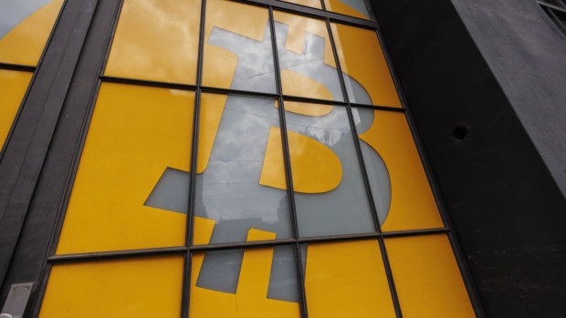 A Bitcoin logo on the doors of the venue of the Paralelni Polis project, an organisation combining art, social sciences and modern technology, in Prague, Czech Republic, on Tuesday, May 17, 2022. Crypto companies have started to plan for a potential protracted market slowdown. Photographer: Milan Jaros/Bloomberg