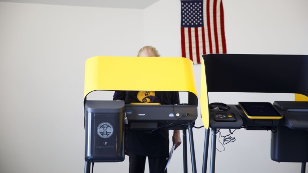 A voter casts a ballot on an electronic Voting Solutions for All People (VSAP) ballot marking machine at an early voting polling location at Dockweiler Beach for the 2020 Presidential election in Los Angeles, California, U.S., on Thursday, Oct. 29, 2020. With eight days until the election, 59.4 million people have cast ballots in-person at early voting centers or by mail, according to the U.S. Elections Project. Photographer: Patrick T. Fallon/Bloomberg