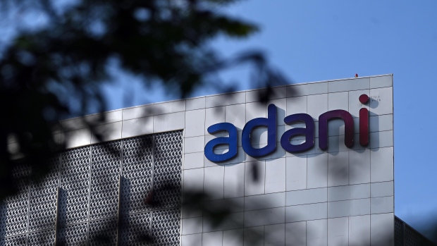 Signage atop the Adani Group headquarters in Ahmedabad, India, on Wednesday, March 8, 2023. A meeting was held in London Wednesday, as a part of a worldwide roadshow aimed at reassuring international investors that the ports-to-power empire’s finances are under control, after as much as $153 billion in combined market value was erased from company stocks following a January short seller’s report. Photographer: Prakash Singh/Bloomberg