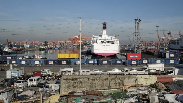 Passenger and cargo ships are docked at the North Port in Manila, the Philippines, on Tuesday, July 21, 2020. Coronavirus cases in the Philippines have more than tripled since stay-home orders in the capital were lifted and most businesses were allowed to reopen starting June.