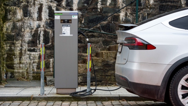 A plug-in electric vehicle charing point in Stavanger, Norway, on Wednesday, Feb. 17, 2021. The Norwegian krone has become the best performing G10 currency in the year to date. Photographer: Carina Johansen/Bloomberg