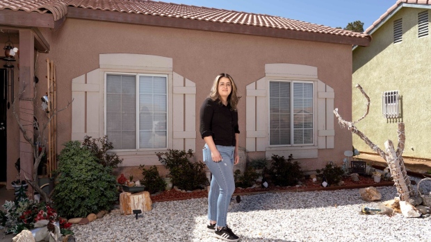Melissa Ojeda outside her family’s home in Adelanto. Photographer: Kyle Grillot/Bloomberg