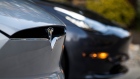 A Tesla Inc. badge is displayed on a Model X electric vehicle in San Ramon, California, U.S., on Saturday, Feb. 8, 2020. Tesla Chief Executive Officer Elon Musk is pushing the Solar Roof and batteries as essential components of the company's drive to reduce fossil fuel use.