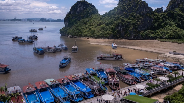 QUANG NINH, VIETNAM - MAY 31: Junk boats carry tourists touring Ha Long Bay, after the Vietnamese government eased the lockdown following the coronavirus disease (COVID-19) outbreak, on May 31, 2020 in Ha Long, Quang Ninh Province, Vietnam. Though some restrictions remain in place, Vietnam has lifted the ban on domestic travel, certain entertainment facilities and non-essential businesses to revive its economy. As of May 31, Vietnam has confirmed 328 cases of coronavirus disease (COVID-19 ) with no deaths in the country, 279 fully recovered and no new case caused by community transmission for 46 days. (Photo by Linh Pham/Getty Images)