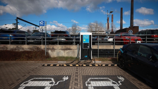 Electric vehicle (EV) charging stations in the parking lot of a train station near the Volkswagen AG headquarters and auto plant complex in Wolfsburg, Germany, on Tuesday, Feb. 28, 2023. Volkswagen wants to remain a strong player in Europe and China, but in the face of growing geopolitical tensions and an increasingly complex regulatory environment, the German carmaker is looking beyond the US for markets with growth potential. Photographer: Krisztian Bocsi/Bloomberg