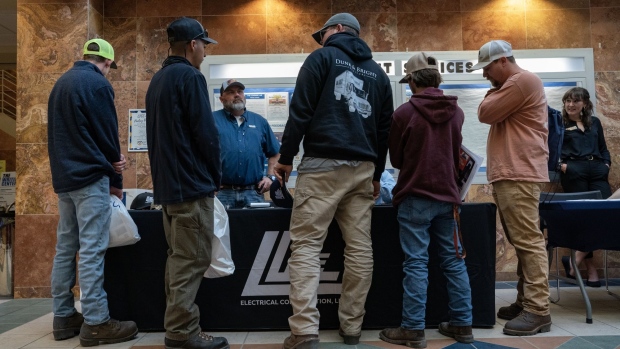 A representative speaks with jobseekers during a Construction Career Fair in Wilmington, North Carolina, US. Photographer: Allison Joyce/Bloomberg