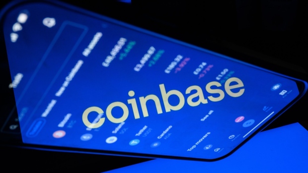 LONDON, ENGLAND - NOVEMBER 09: In this photo illustration, a flipped version of the Coinbase logo is reflected in a mobile phone screen on November 09, 2021 in London, England. The cryptocurrency exchange platform is to release its quarterly earnings today. (Photo illustration by Leon Neal/Getty Images)