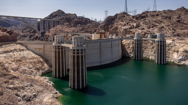 The Hoover Dam on the Colorado River during low water levels in Arizona, Nevada, U.S., on Thursday, Aug. 19, 2021. Federal officials ordered the first-ever water cuts on the Colorado River system that sustains 40 million people, the latest blow from a decades-long drought across the U.S. West that has shrunk reservoirs to historic lows, devastated farms and set the stage for deadly forest fires.