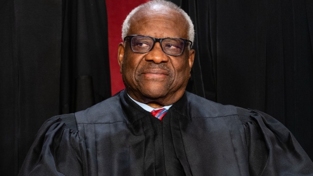 Associate Justice Clarence Thomas during the formal group photograph at the Supreme Court in Washington, DC, US, on Friday, Oct. 7, 2022. The court opened its new term Monday with a calendar already full of high-profile clashes, including two cases that could end the use of race in college admissions. Photographer: Eric Lee/Bloomberg 