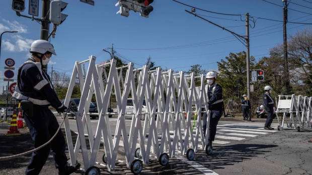 Police officers close a barricade on a road near the venue of G7 Foreign Minister's meeting in Karuizawa town of Nagano prefecture on April 16, 2023.  Photographer: Yuichi Yamazaki/AFP/Getty Images