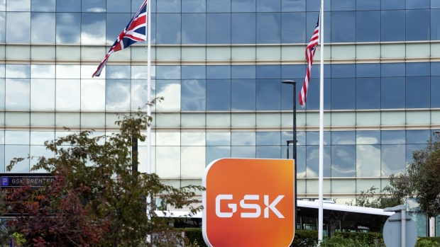 The GSK Plc logo on a sign outside the headquarters of the company in the Brentford district of London, UK, on Monday, Oct. 31, 2022. GSK is due to report its latest earnings figures on Nov. 2. Photographer: Chris Ratcliffe/Bloomberg