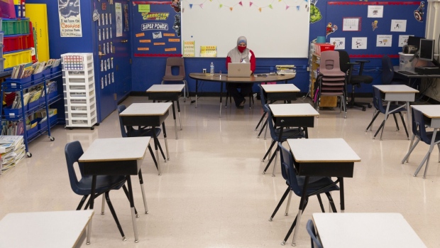 A teacher sits at her desk at John B. Wright Elementary School in Tucson, Arizona.