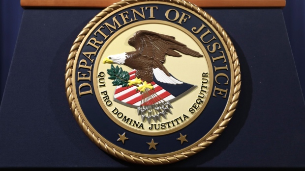 The U.S. Department of Justice seal is displayed on a podium following a news conference with Rod Rosenstein, deputy attorney general, not pictured, in Washington, D.C., U.S. on Thursday, Dec. 20, 2018. Rosenstein announced accusations that two Chinese nationals conducted an "extensive" hacking campaign in association with Chinese state security officials for more than a decade. Photographer: Yuri Gripas/Bloomberg