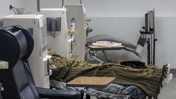 A patient suffering from kidney failure remains connected to the devices while undergoing hemodialysis in a room at the Hospital Clinico Universitario in Caracas, on February 24, 2022. Photographer: Yuri Cortez/AFP/Getty Images