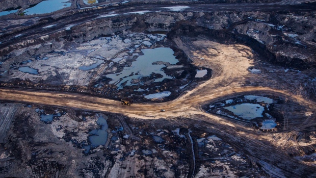 The Suncor Energy Inc. Millennium mine is seen in this aerial photograph taken above the Athabasca oil sands near Fort McMurray, Alberta, Canada, on Monday, Sept. 10, 2018. While the upfront spending on a mine tends to be costlier than developing more common oil-sands wells, their decades-long lifespans can make them lucrative in the future for companies willing to wait.