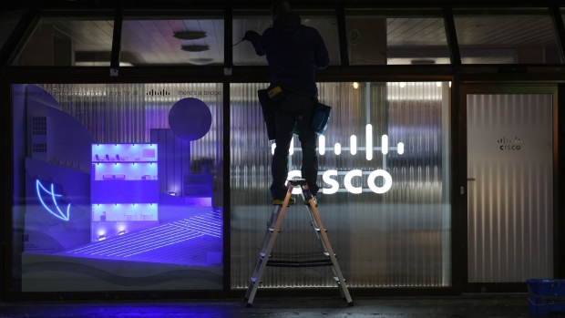 A worker sets up the Cisco Systems Inc. pop-up office ahead of the World Economic Forum (WEF) in Davos, Switzerland, on Monday, Jan. 16, 2023. The annual Davos gathering of political leaders, top executives and celebrities runs from January 16 to 20. Photographer: Hollie Adams/Bloomberg