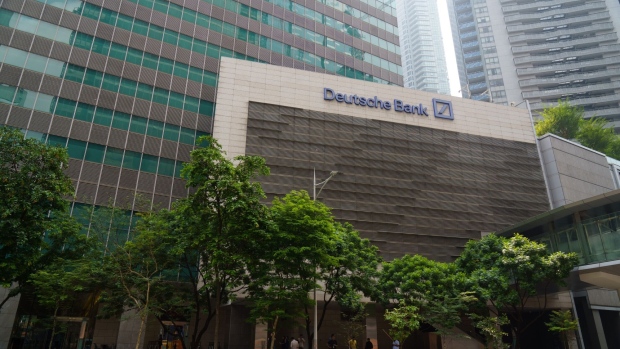 Deutsche Bank AG signage at the One Raffles Quay complex in Singapore, on Friday, April 14, 2023. Deutsche Bank aims to double private-banking revenue from Asia in five years by ramping up efforts to attract the region’s ultra-wealthy, joining other firms seeking to pounce on opportunities created by the near-collapse of Credit Suisse Group AG. Photographer: Ore Huiying/Bloomberg