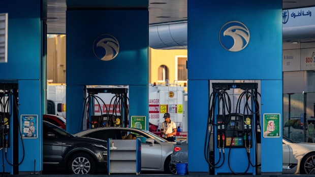 A worker refuels vehicles on the forecourt of an Abu Dhabi National Oil Co. (ADNOC) gas station in the Jumeirah district of Dubai, United Arab Emirates, on Thursday, April 20, 2023. Abu Dhabi’s main energy company ADNOC raised $2.5 billion from the initial public offering of its gas business, pulling off the year’s biggest listing and continuing a trend that saw the Middle East emerge as a bright spot for share sales in 2022.