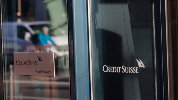 A logo on the window of a Credit Suisse Group AG bank branch in Zurich, Switzerland, on Tuesday, March 21, 2023. Recruiters across the world are getting an unprecedented flood of calls from Credit Suisse bankers seeking new jobs as the embattled Swiss lender is set to be taken over by UBS Group AG. Photographer: Stefan Wermuth/Bloomberg