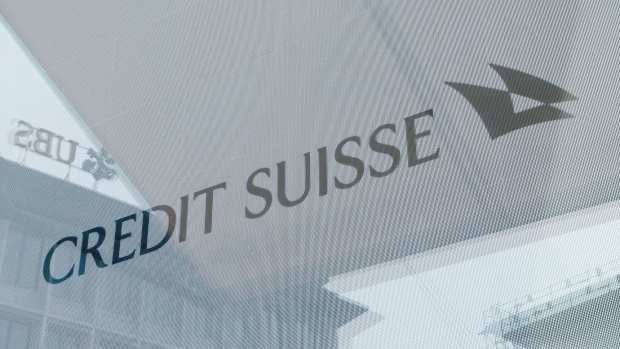 Signage in the window of the Credit Suisse Group AG headquarters in Zurich, Switzerland, on Tuesday, March 21, 2023. Recruiters across the world are getting an unprecedented flood of calls from�Credit Suisse bankers seeking new jobs as the embattled Swiss lender is set to be taken over by�UBS Group AG.