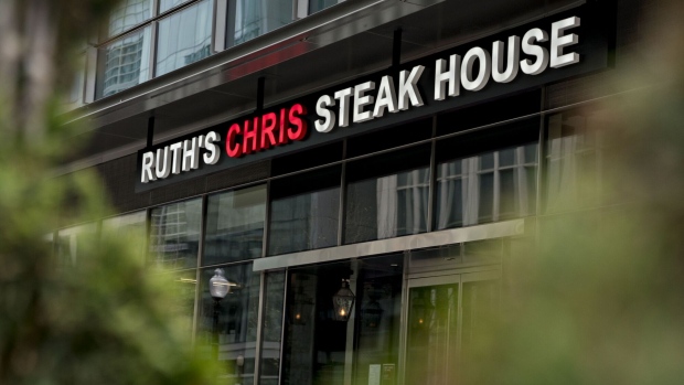 A Ruth's Chris restaurant stands in Washington, D.C., U.S., on Monday, April 20, 2020. More than a dozen publicly traded companies with revenue of more than $100 million, including Ruth's Chris steak houses, received loans through a massive relief program aimed at small businesses.