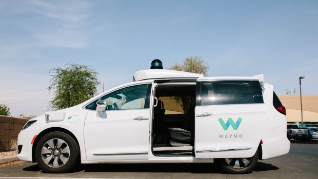 A Waymo LLC Chrysler Pacifica autonomous vehicle sits parked in Chandler, Arizona, U.S., on Monday, July 30, 2018. The Google offshoot is tinkering with pricing and finalizing its business model for autonomous vehicles, which includes a new effort to boost public transit.