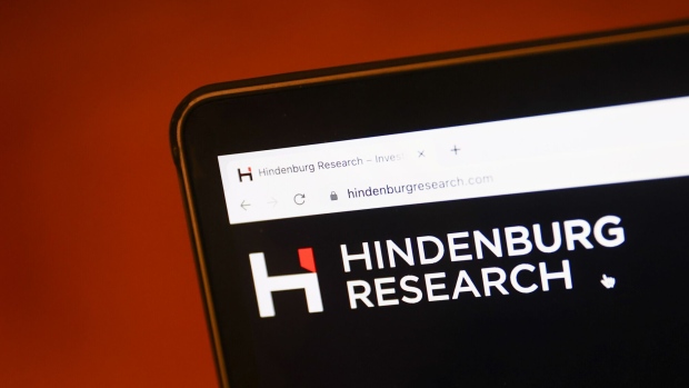 Hindenburg Research website displayed on a laptop screen and Adani logo displayed on a phone screen are seen in this illustration photo taken in Krakow, Poland on February 2, 2023.  Photographer: Jakub Porzycki/NurPhoto/Getty Images